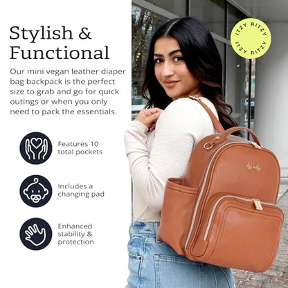 Itzy Ritzy Mini Diaper Bag Backpack – Chic, Compact Mini Plus Backpack with Changing Pad, 10 Pockets (6 Internal, 4 External), Grab-Top Handle & Rubber Feet (Cognac) - color: Cognac